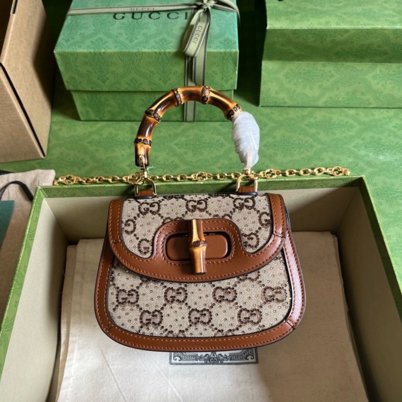 G*u*i top handle bags